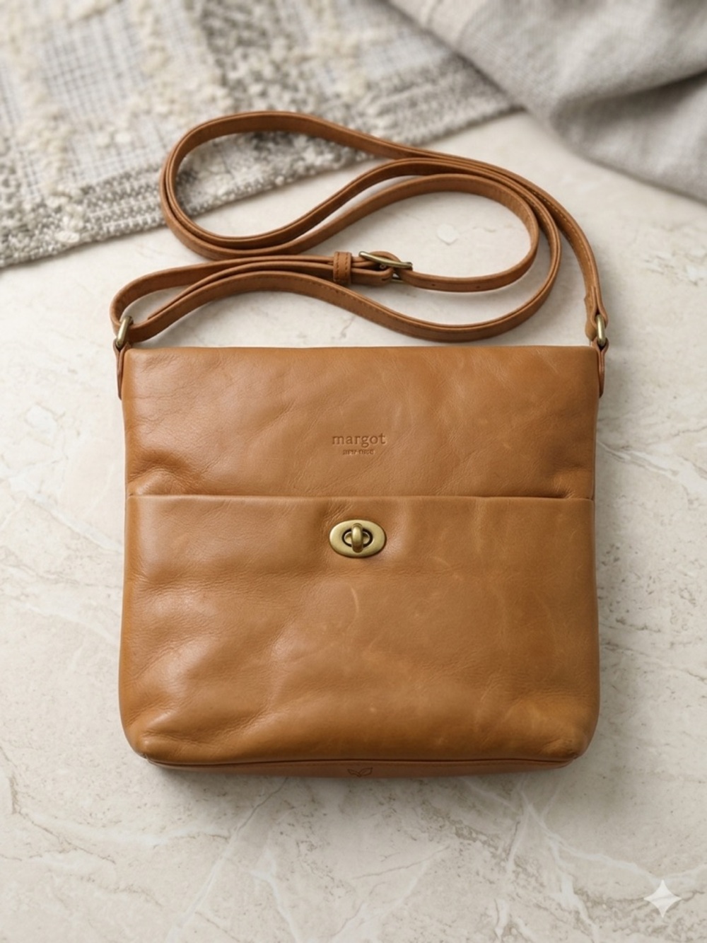 margot caramel tan leather shoulder bag with brass turn-lock